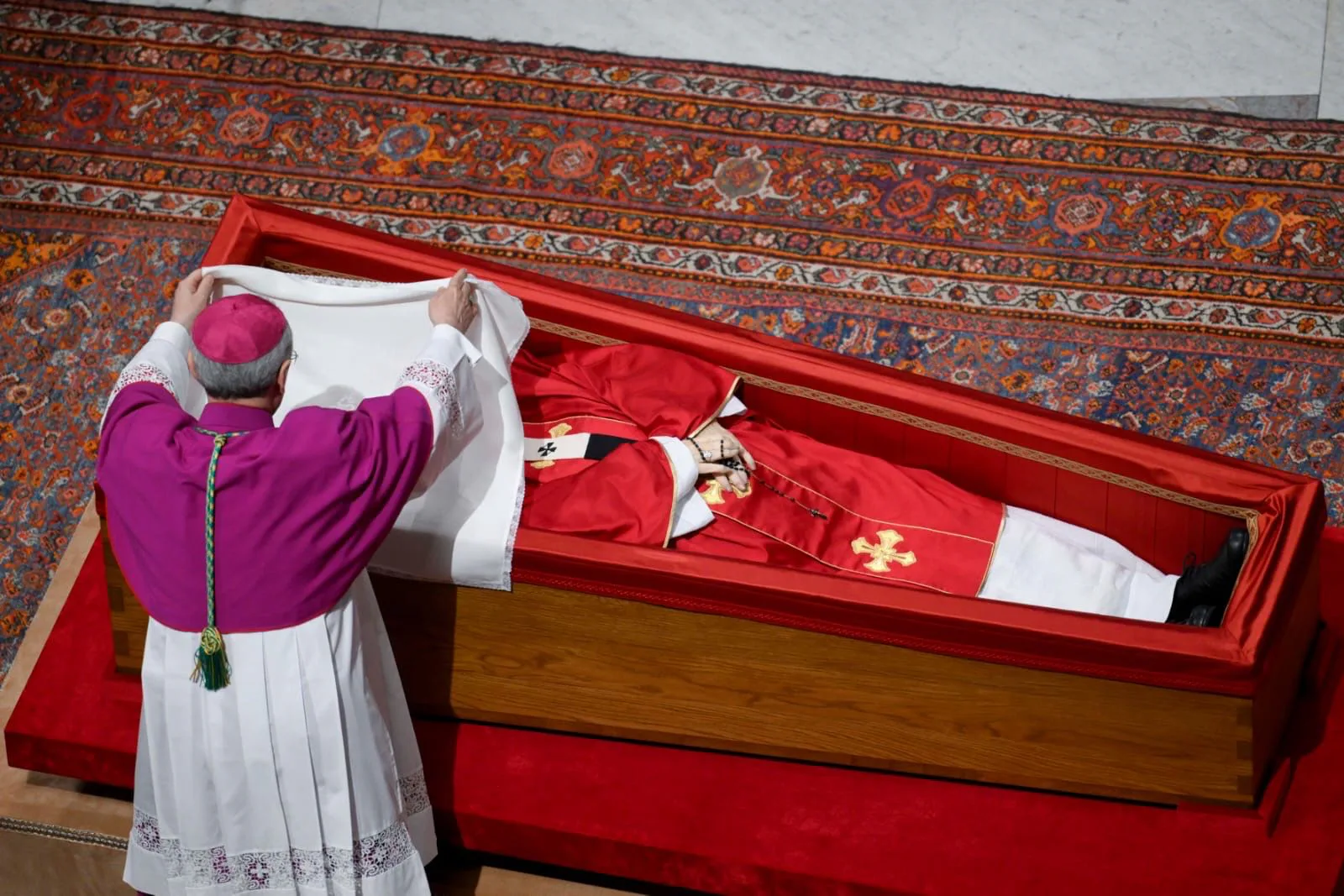Final rites before eternal entombment in a basilica’s wall.